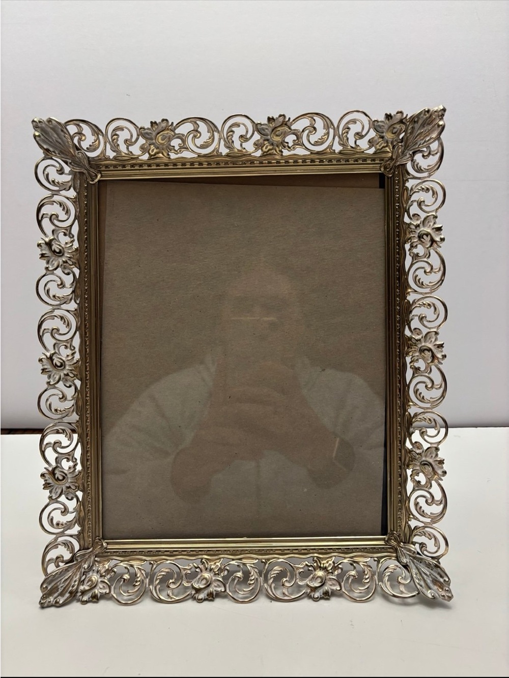 vintage Hollywood Regency-style ornate gold-tone metal picture frame